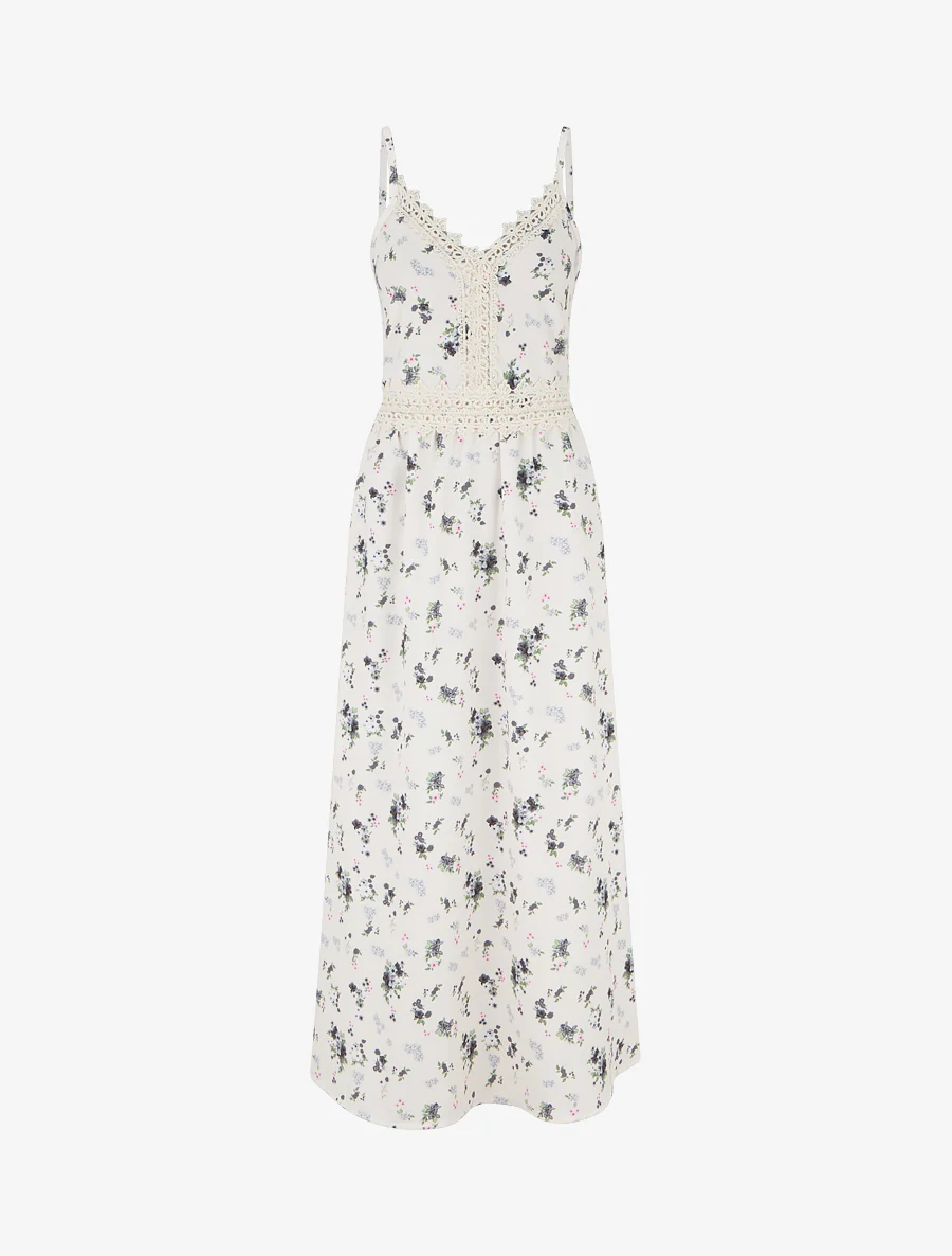 Lange jurk met kleine bloemenprint en haakdetails. - Zwart