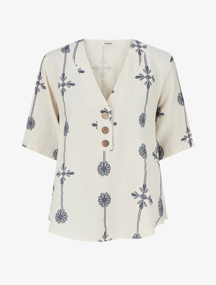 Ruimvallend top met korte mouwen en bloemenprint - Beige